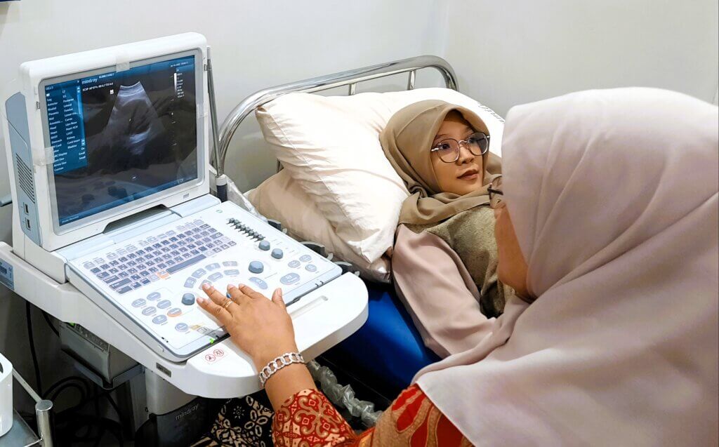 Expectant mother receiving prenatal care at a puskesmas, primary health center, in Serang Indonesia.