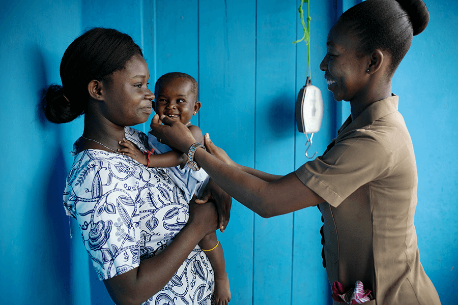 mother and child receiving care from a primary health care provider in Ghana